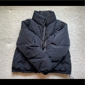 Black puffer jacket, size medium.